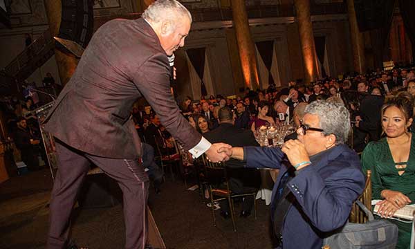 auctioneer shaking hands